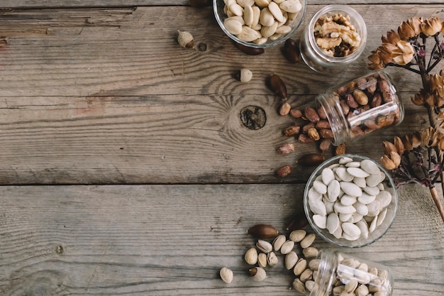 Various nuts in glasses with space on top