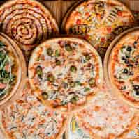 Free photo various pizzas on the table top view