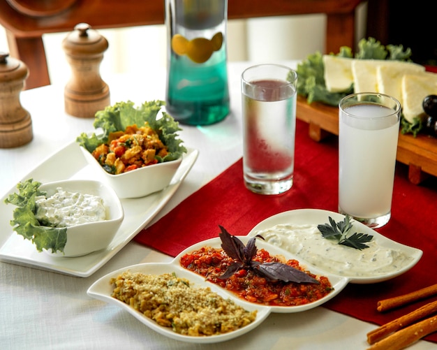 Various salads with glass of water