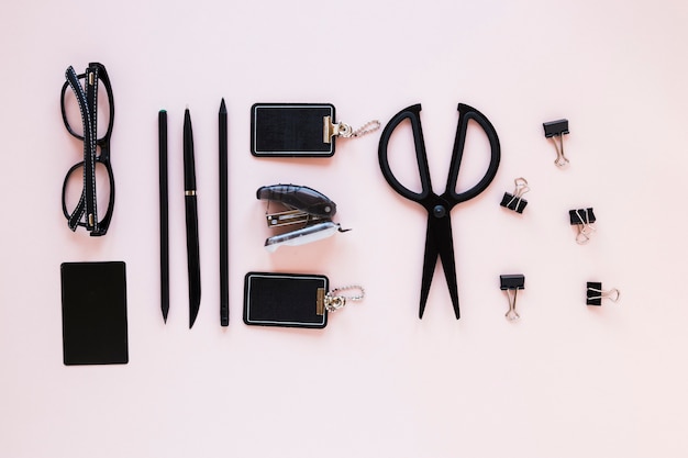 Various stationary on pink desk