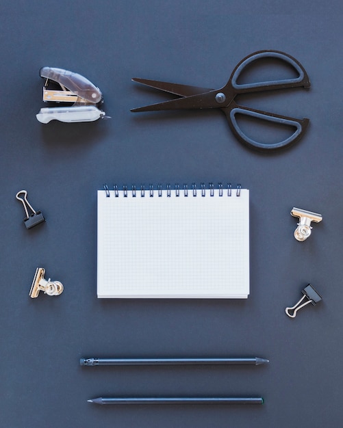 Various stationery on dark blue table