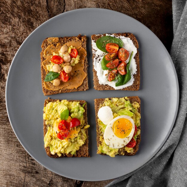 Free photo various toasts with veggie cream flat lay