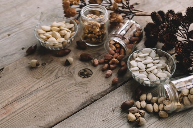 Free photo various types of nuts on wooden surface