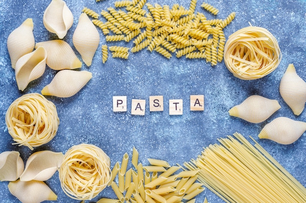 Free photo various types of uncooked pasta.