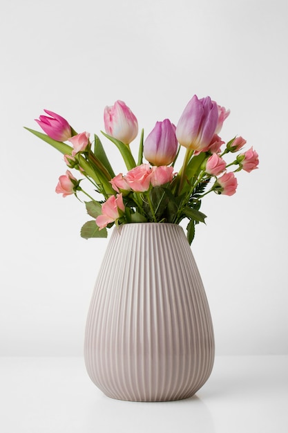 Vase with tulips and roses