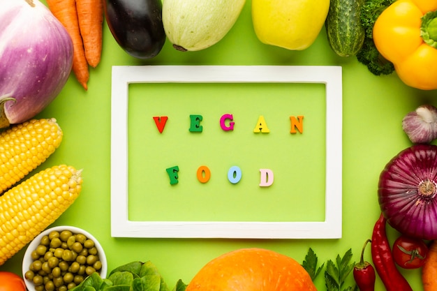 Free photo vegan food lettering in white frame