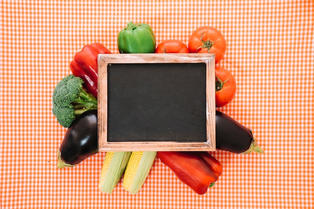 Free Photo vegetable composition on cloth with slate