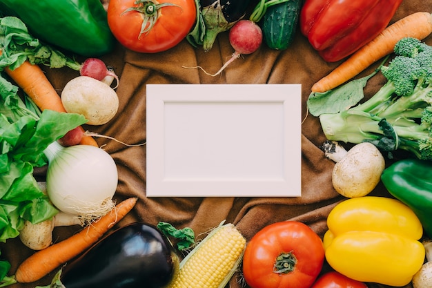 Free photo vegetable composition with frame in middle