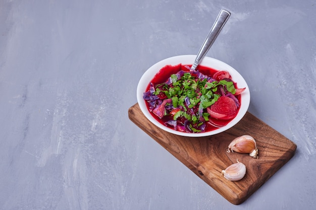 Vegetable salad sliced on blue