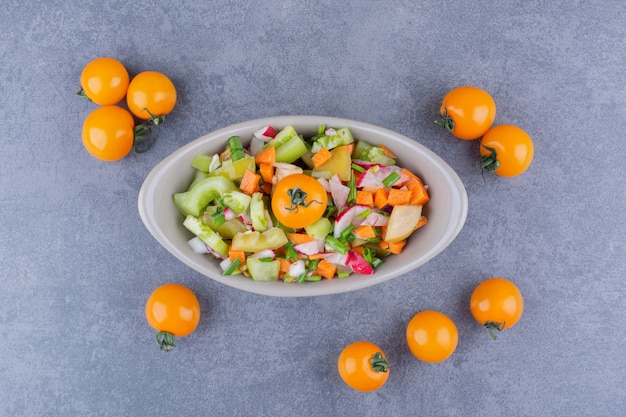 Free Photo vegetable salad with seasonal foods in a ceramic dish