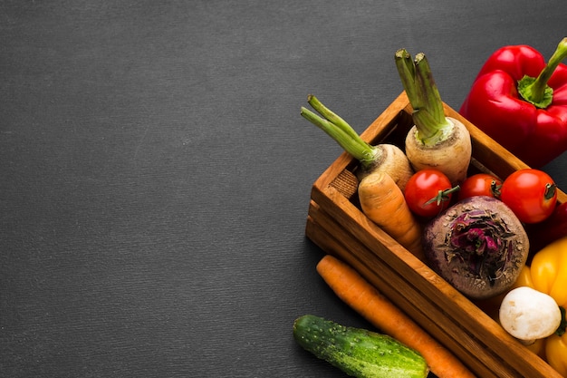 Free Photo vegetables composition on dark background with copy space