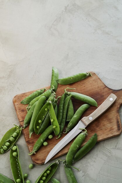 Vegetables. Green peas on the table