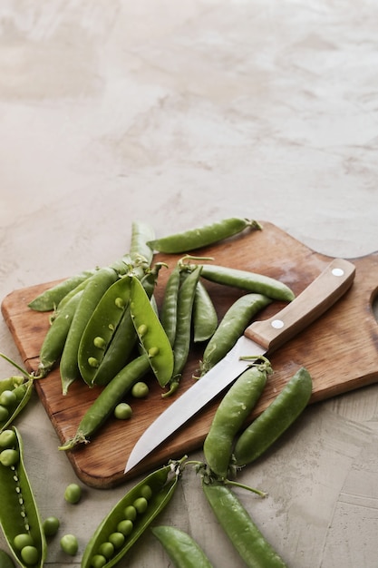 Vegetables. Green peas on the table