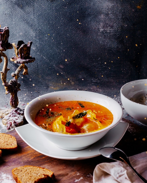 Free Photo vegetables soup colored hot with vegetables pieces inside white plate on the bright surface