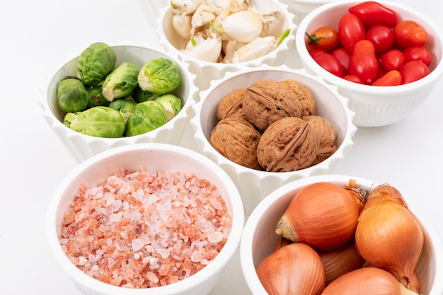 Vegetables in white bowls