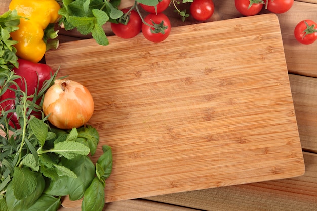 Vegetables with a chopping board