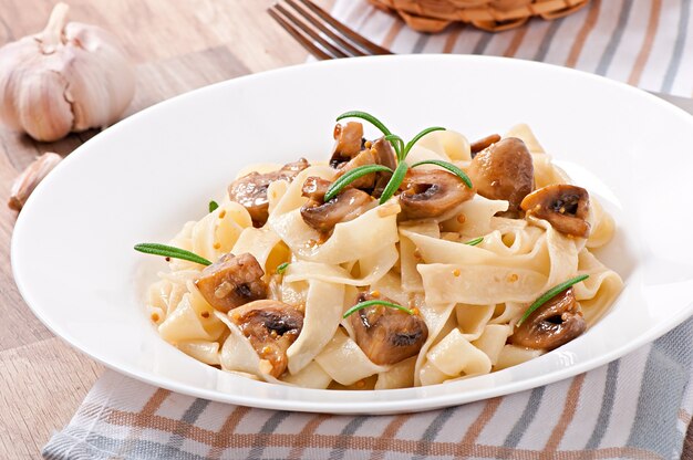 Vegetarian dish with tagliatelle and mushrooms