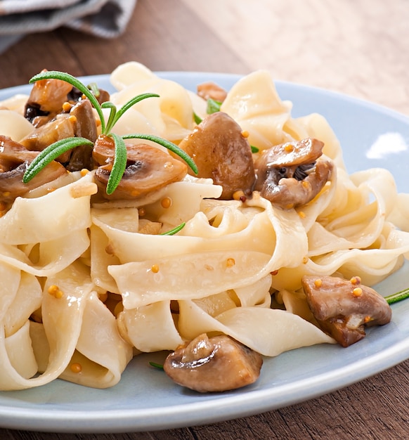 Vegetarian dish with tagliatelle and mushrooms