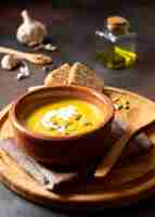 Free photo veggies creme soup winter food on wooden board