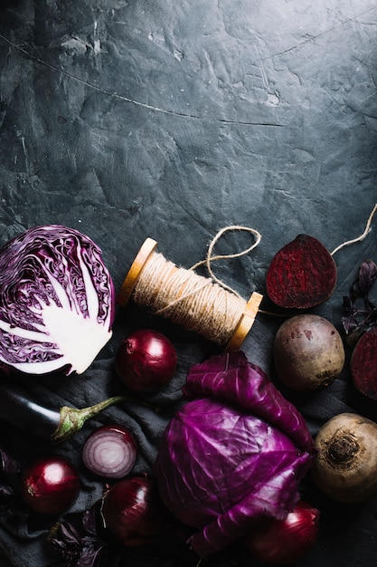 Free photo veggies and rope on a grunge copy space background