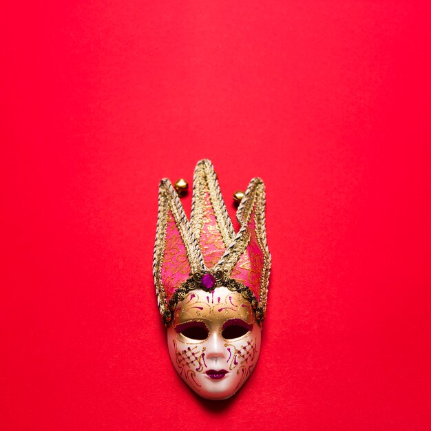 Venetian mask on red