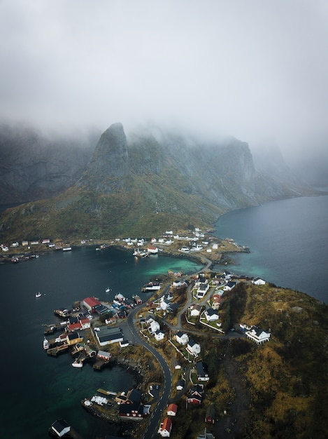 Vertical aerial view of the beautiful town of Lofoten in Norway captured in the fog