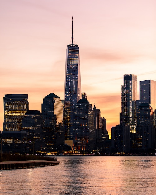 Vertical distant shot of The World Trade Center building in New York during sunset