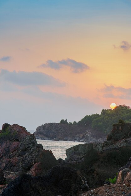 Vertical high angle shot of the beautiful sunset at Kudlu Beach, Gokarna, India