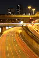 Free photo vertical high angle shot of an illuminated highway at night