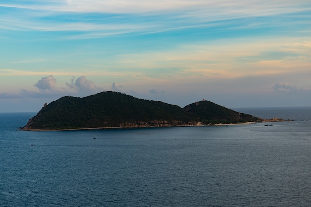 Vertical image of a beautiful island under a cloudy sky in Phu Yen, Vietnam