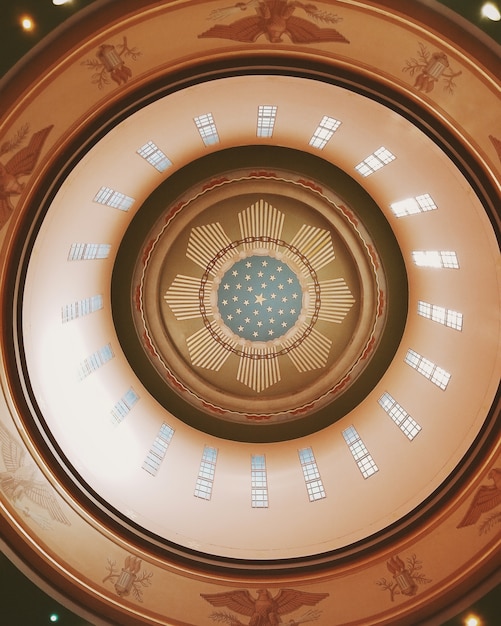 Free photo vertical low angle shot of a ceiling inside a historical building with interesting textures