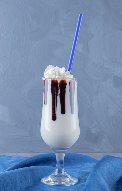 Free photo vertical photo of freshly made chocolate milk shake.