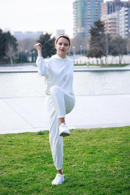 Vertical photo of young athlete doing her routine workouts High quality photo