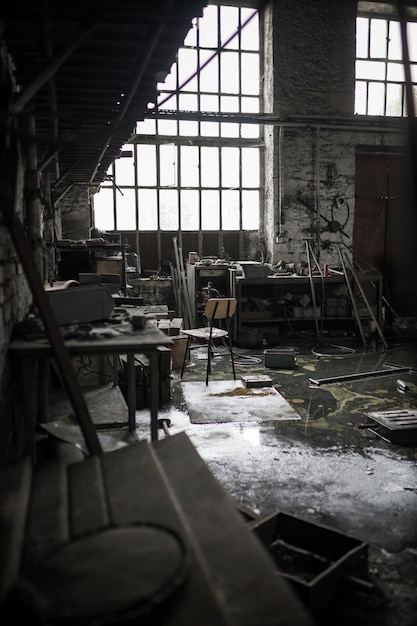 Vertical shot of an abandoned messy warehouse