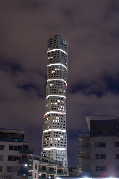 Free photo vertical shot of the ankarparken skyscraper at night time