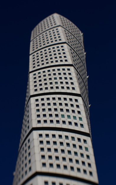 Vertical shot of the Ankarparken skyscraper with a dark blue sky in the background