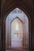 Free photo vertical shot of the arch shaped hallways in an old building