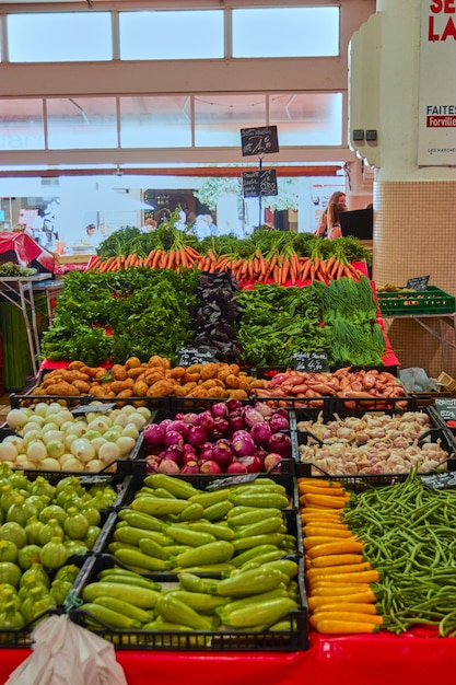 Free Photo vertical shot of the bazaar full of different vegetables