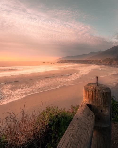 Free Photo vertical shot of the beach during a sunset