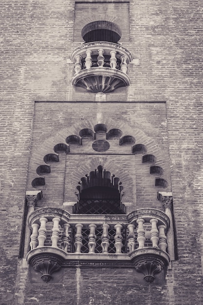 Free Photo vertical shot of a beautiful balcony of a historic building in spain