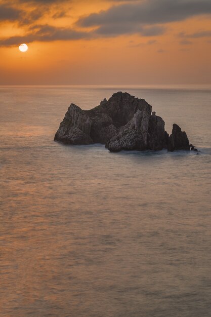 Vertical shot of a beautiful Costa Quebrada during the sunset in Spain