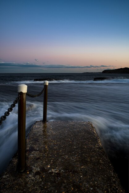 Vertical shot of a beautiful seascape at sunset