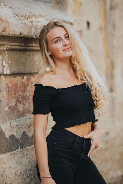 Vertical shot of beautiful smiling woman outdoors