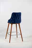 Free photo vertical shot of a blue chair made up of wooden legs