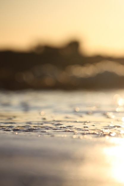 Free Photo vertical shot of blurred sea during sunset great for wallpaper