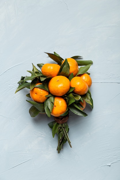 Vertical shot of a bouquet from fresh tangerines