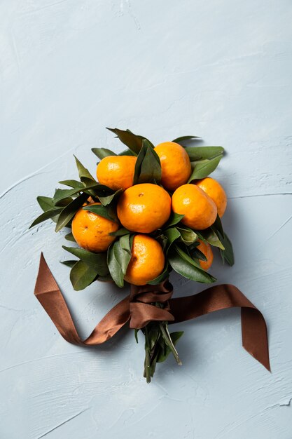 Vertical shot of a bouquet from fresh tangerines