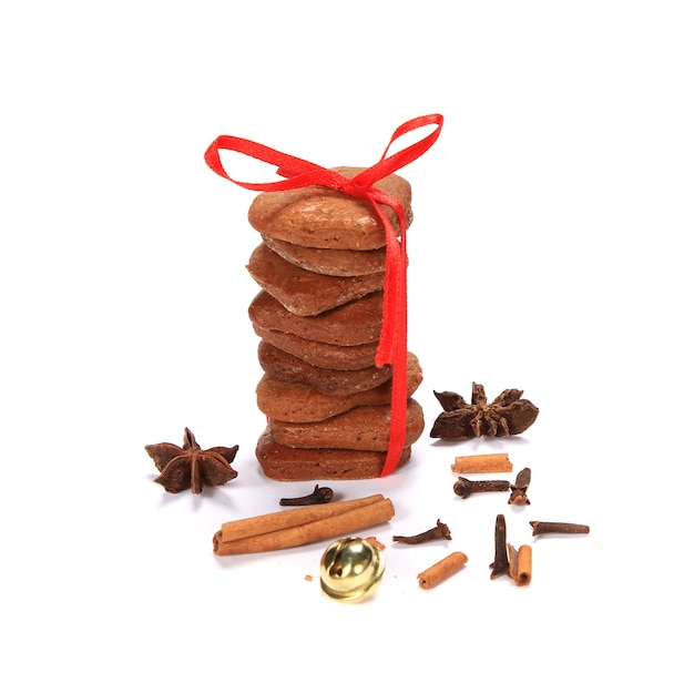 Free Photo vertical shot of christmas-themed stacked cookies on a white surface