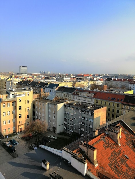 Free photo vertical shot of the city during sunny a day in warsaw, poland