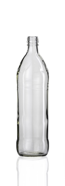 Vertical shot of an empty glass bottle isolated on a white